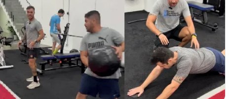 Professor acompanhando de perto um aluno no Personal Compartilhado